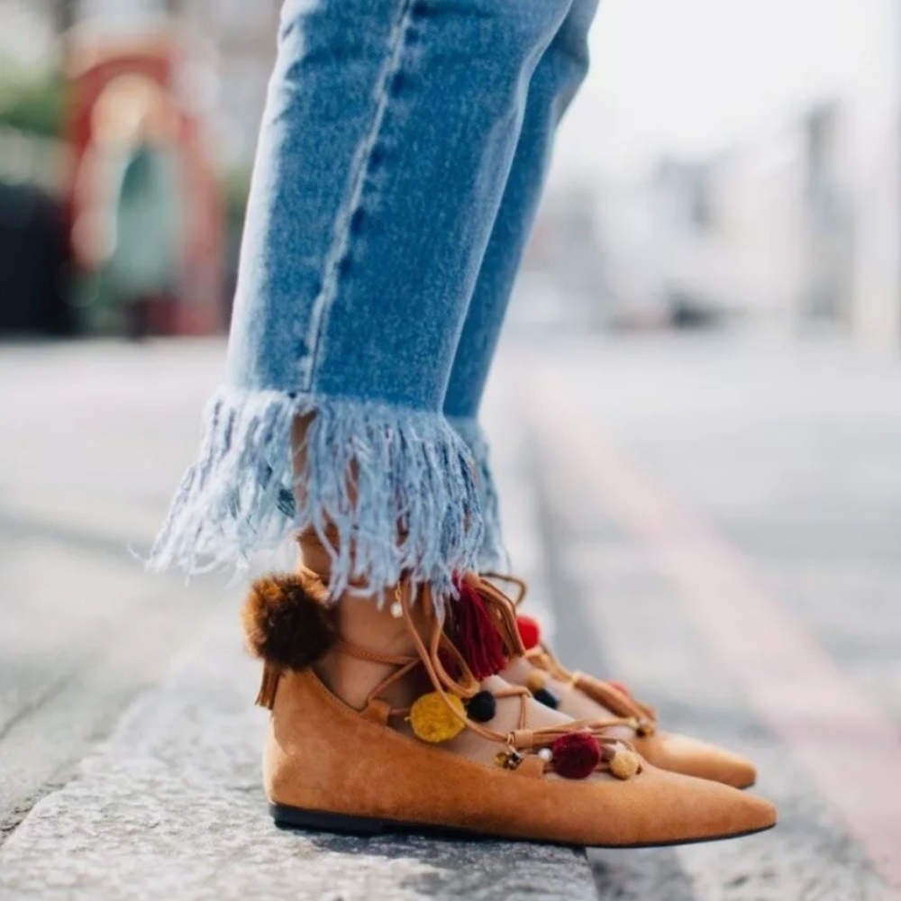 Alameda Turquesa flats with pom poms and tassels